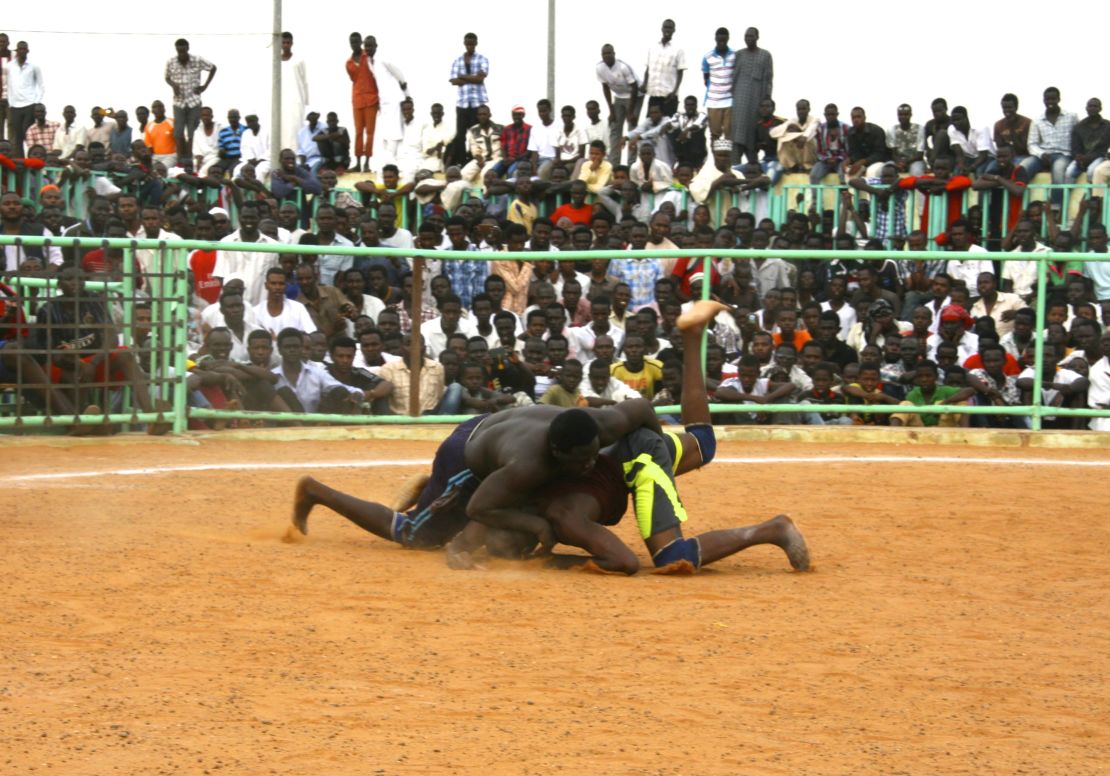 The wrestling tournaments attract hundreds of spectators in Khartoum. 