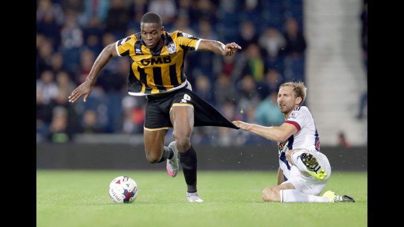 West Brom's Craig Dawson fouls Port Vale's Uche Ikpeazu during a League Cup match played Tuesday, August 25, in West Bromwich, England. West Brom advanced after a penalty shootout.