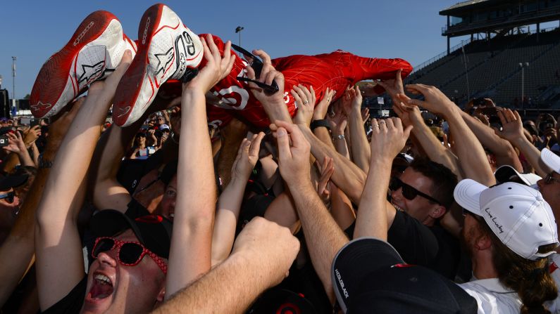 Scott Dixon surfs the crowd after winning the IndyCar race in Sonoma, California, on Sunday, August 30. It was the final race of the season, and Dixon's victory catapulted him to his fourth IndyCar championship.