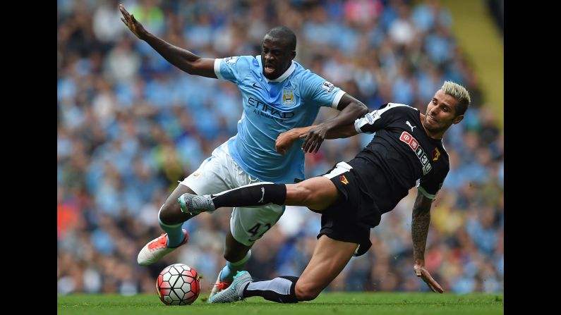 Watford's Valon Behrami slides in on Manchester City's Yaya Toure during a Premier League match in Manchester, England, on Saturday, August 29.