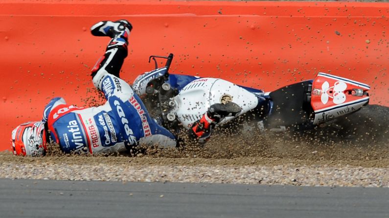 Hector Barbera falls from his bike during MotoGP qualifying in Silverstone, England, on Saturday, August 29. He finished 13th in the race the next day.