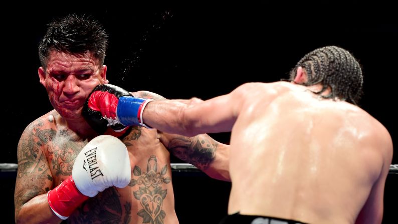 Hector Munoz takes a punch from Alfredo Angulo during their super-middleweight bout in Los Angeles on Saturday, August 29. Angulo won by a fifth-round TKO.
