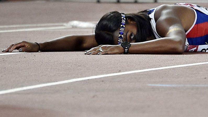 British hurdler Tiffany Porter lies on the track after she fell at the end of the 110-meter race at the World Championships on Friday, August 28. She finished in fifth place.