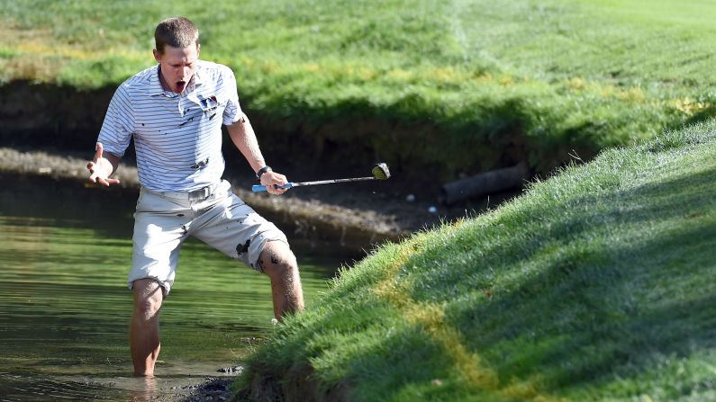 Peter Malnati reacts after his shot out of a muddy hazard <a href="index.php?page=&url=http%3A%2F%2Fbleacherreport.com%2Farticles%2F2557006-golfer-emerges-muddy-and-soaked-after-futilely-hacking-at-ball-near-water-hazard" target="_blank" target="_blank">ended right back in front of him</a> during a Web.com tournament in North Plains, Oregon, on Thursday, August 27. "Are you kidding me?" said Malnati, who had rolled up his pants to play the shot.