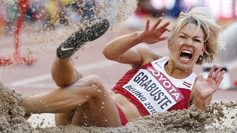 Latvian long jumper Aiga Grabuste lands in the sandpit during the World Championships on Thursday, August 27.