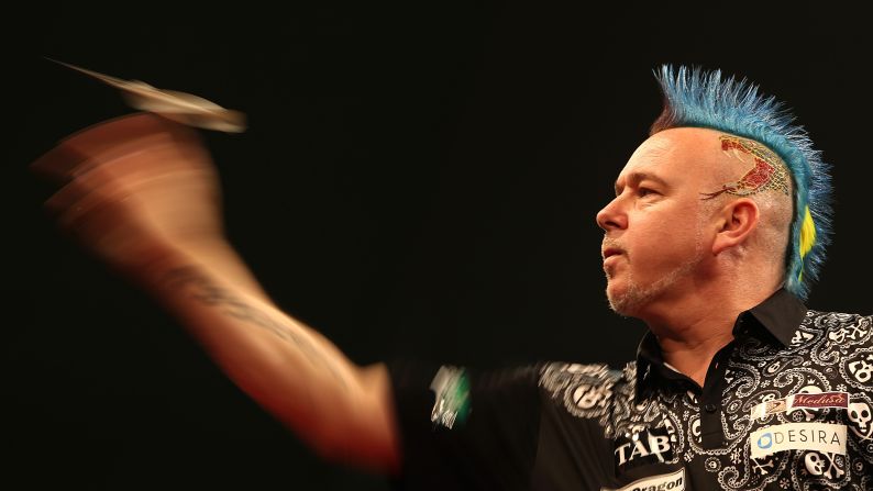 Colorful darts player Peter Wright competes at an event in Auckland, New Zealand, on Saturday, August 29.