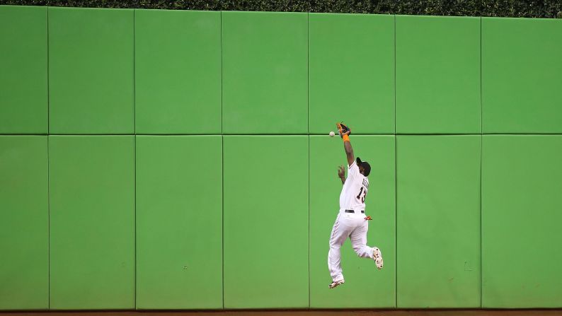Miami's Marcell Ozuna misses a fly ball during a home game against Pittsburgh on Thursday, August 27. <a href="index.php?page=&url=http%3A%2F%2Fwww.cnn.com%2F2015%2F08%2F25%2Fsport%2Fgallery%2Fwhat-a-shot-sports-0825%2Findex.html" target="_blank">See 45 amazing sports photos from last week</a>
