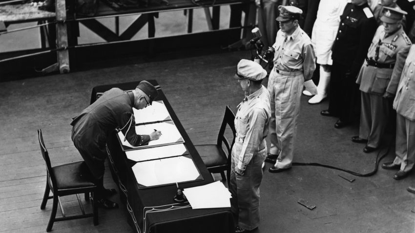2nd September 1945:  General Douglas MacArthur (1880 - 1964) as Supreme Commander of the Allied Forces accepts the unconditional surrender document signed by the Japanese Yoshijiro Umezu and watched by representatives of the Allied Nations. They are on board the USS Missouri in Tokyo Bay. 