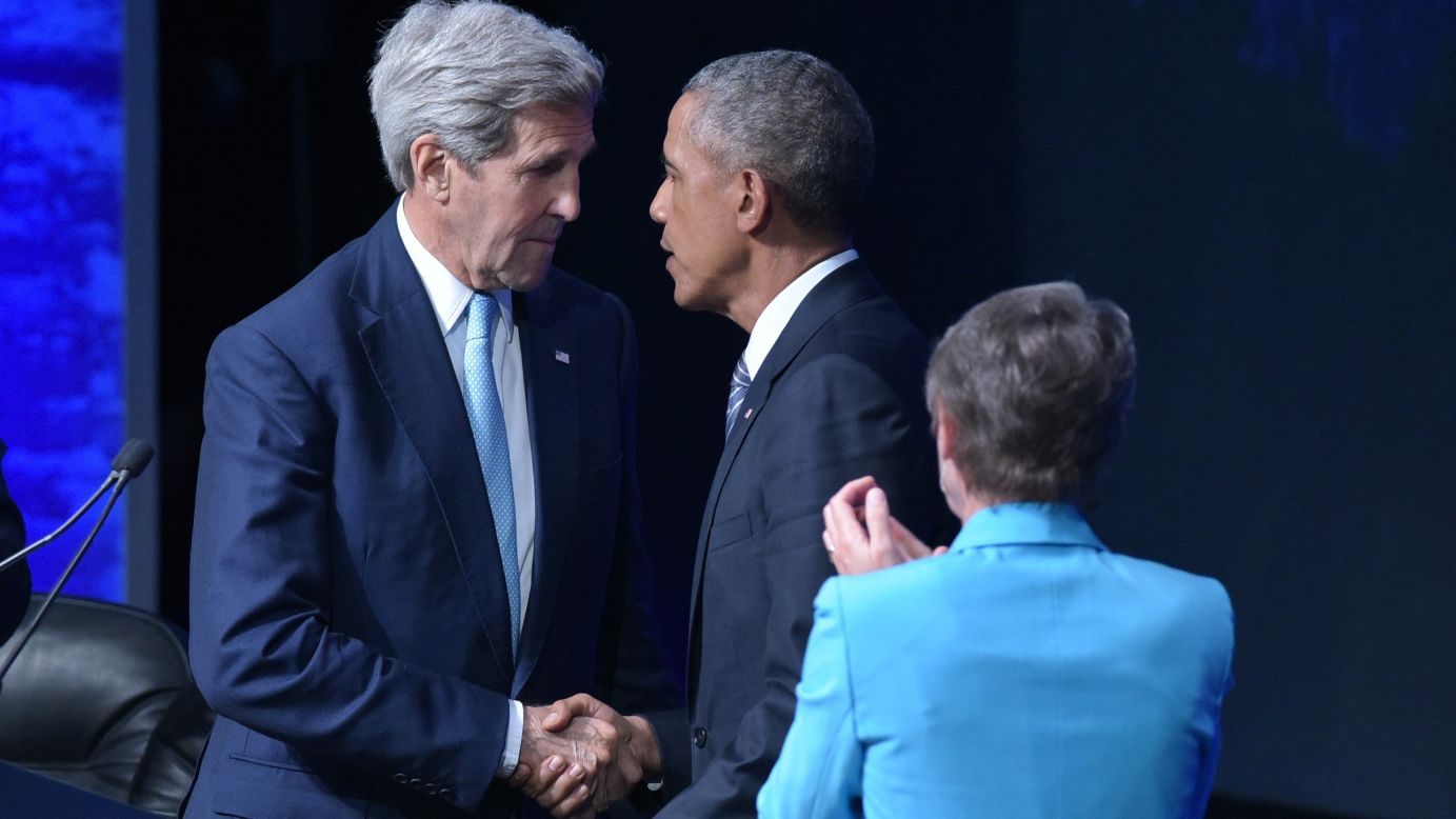 Secretary of State John Kerry shakes hands with Obama after the President spoke at the conference on August 31.