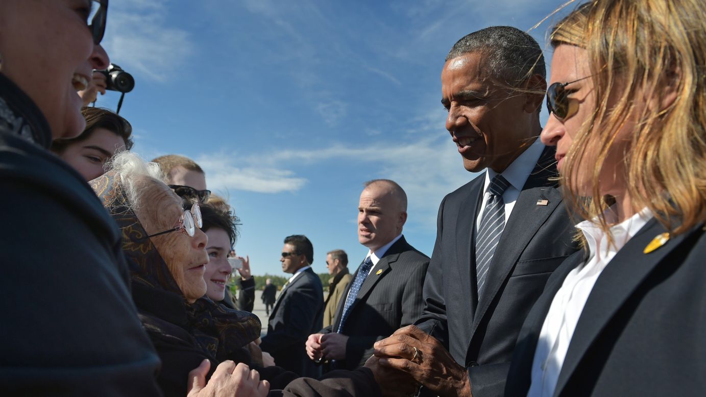 Obama greets well-wishers upon arriving at Elmendorf Air Force Base on August 31.