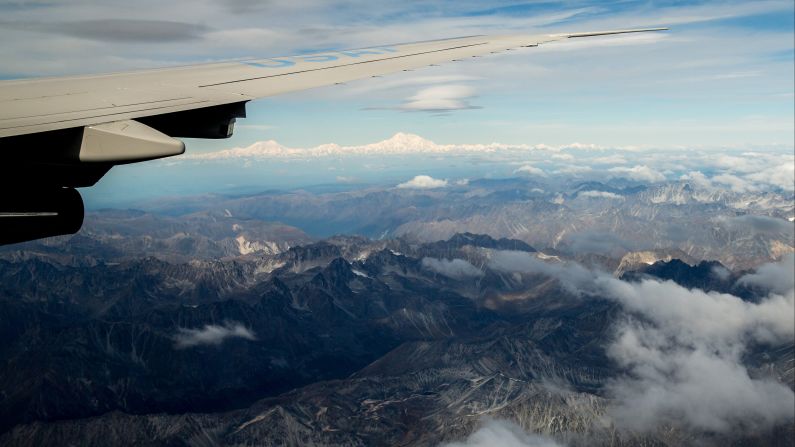 The mountain Denali, top center, is seen from a window of Air Force One as the plane approached Anchorage on August 31. Obama formally <a href="index.php?page=&url=http%3A%2F%2Fwww.cnn.com%2F2015%2F08%2F30%2Fpolitics%2Fobama-alaska-denali-climate-change%2F" target="_blank">changed the name</a> of America's tallest mountain, which used to be called Mt. McKinley. Native Alaskans sought the name change for decades.