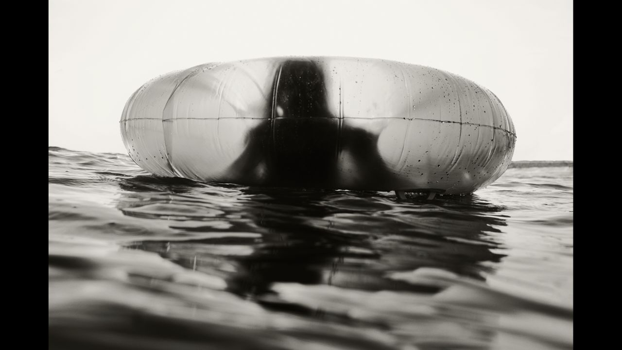 One of Schwedhelm's children floats in an inner tube. 
