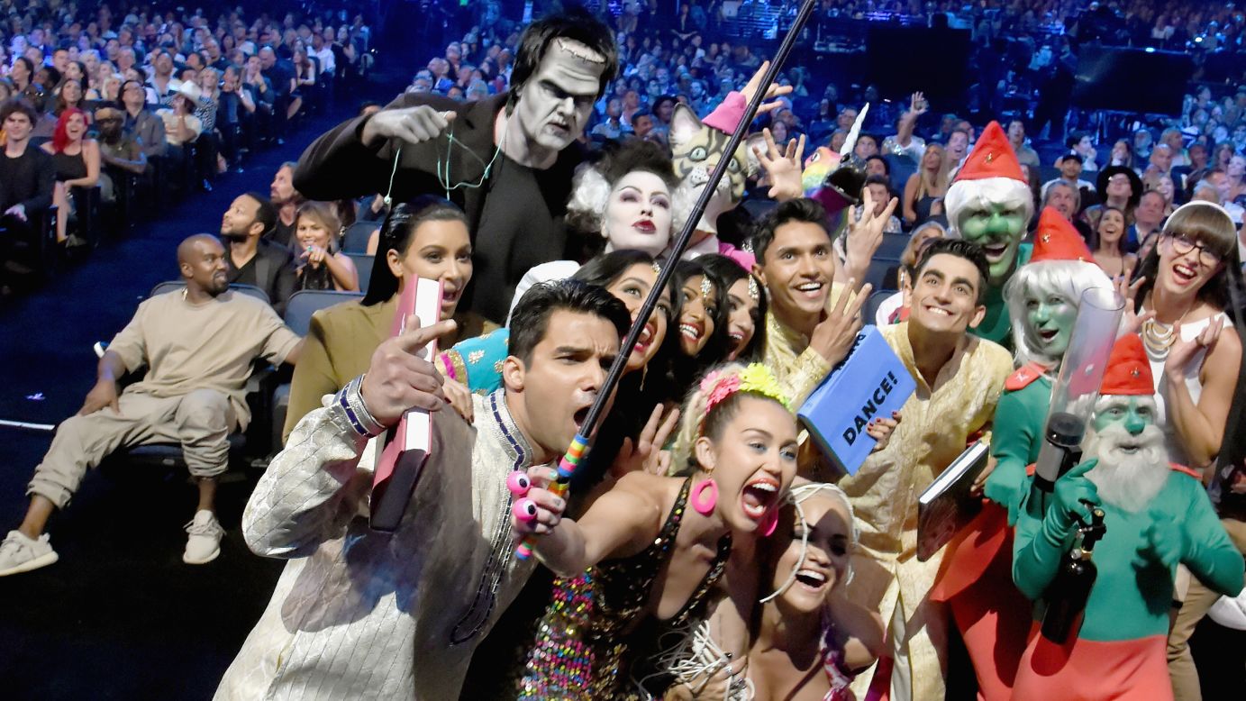 Singer Miley Cyrus uses a selfie stick while hosting the <a href="http://www.cnn.com/2015/08/31/entertainment/vmas-2015-kanye-miley-feat/" target="_blank">MTV Video Music Awards</a> on Sunday, August 30. Among those in the photo are singer Rita Ora, television personality Kim Kardashian and people dressed as Smurfs and Frankenstein.
