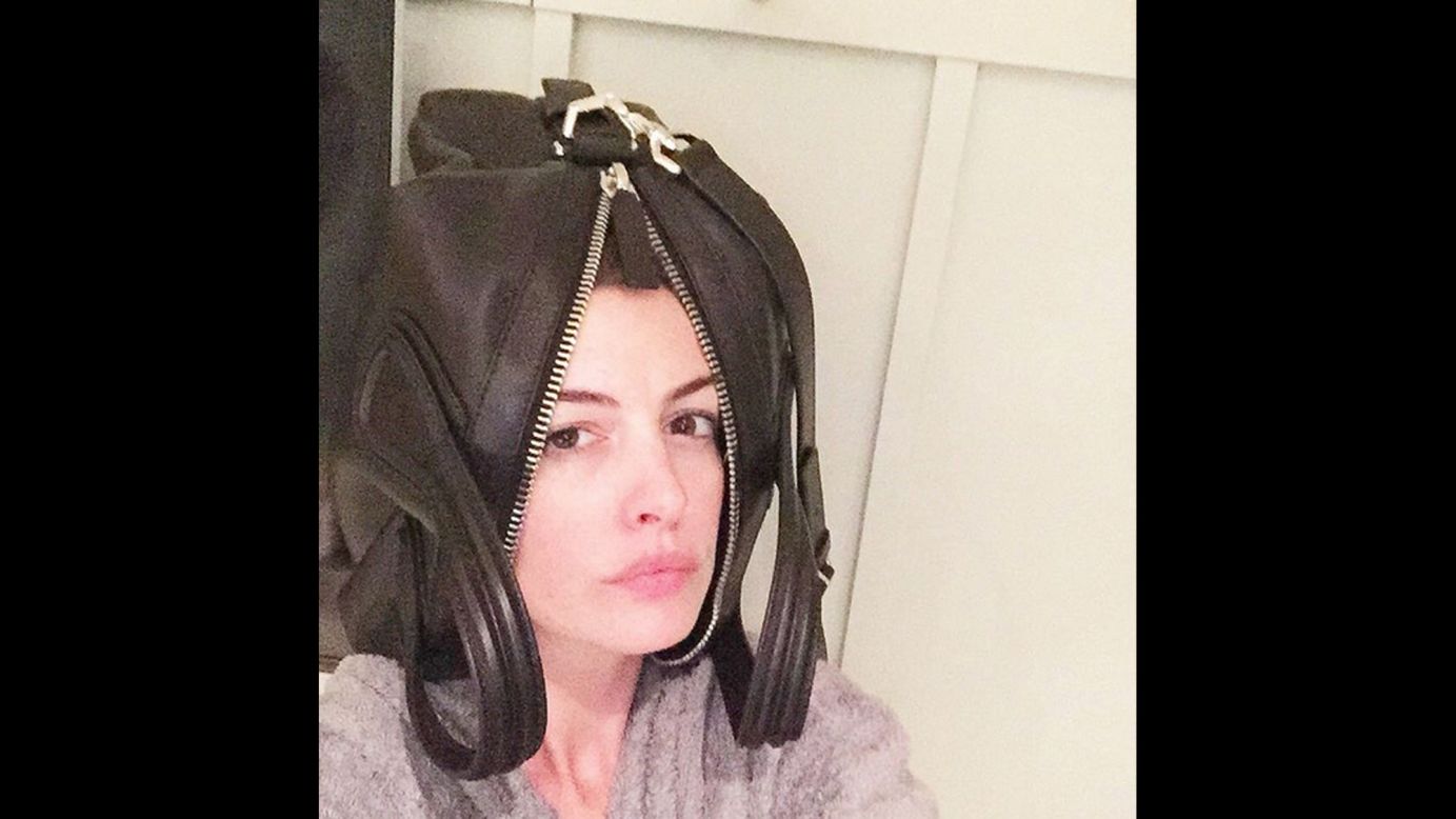 Actress Anne Hathaway wears a Givenchy bag on her head in a silly selfie <a href="https://instagram.com/p/62pHRdF0Ej/" target="_blank" target="_blank">she posted to Instagram</a> on Wednesday, August 26. "Dear @givenchyofficial, your stunning reinterpretation of "the hat" is both revolutionary and awe inspiring," Hathaway joked. "And so roomy! I shall wear mine with pride. Yours in trend-settingness, Annie."