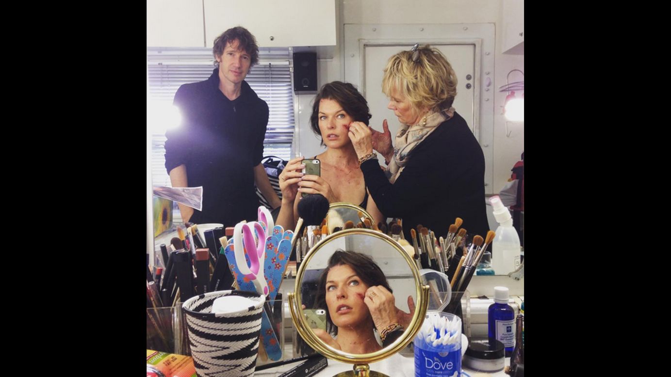 "Resident Evil" star Milla Jovovich takes a selfie Tuesday, September 1, as she has makeup tests done for the film franchise's latest sequel. "Our director came in for a peek. #moreblood #hero," <a href="https://instagram.com/p/7Fj9pnzMvC/" target="_blank" target="_blank">she said on Instagram.</a>