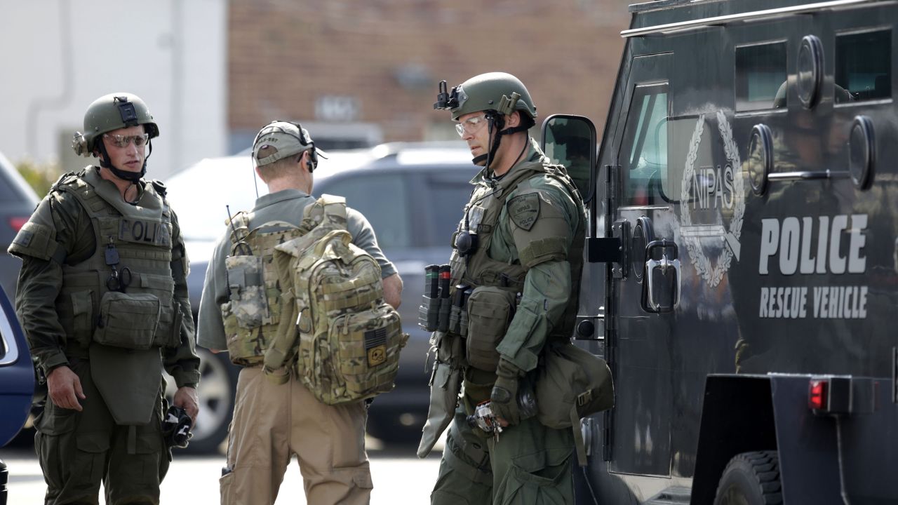 Police officers meet up before heading out for the search.