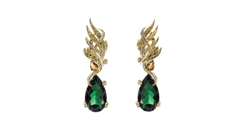 "The top part of these cocktail earrings are in 18-carat yellow gold. The motif is inspired by the wing of a bird. Each line of gemstones mimics that of a feather. There's a gradation of color -- green peridots, green garnets, yellow sapphires and white diamonds that mimic the ombre color effect from a layer of feathers."
