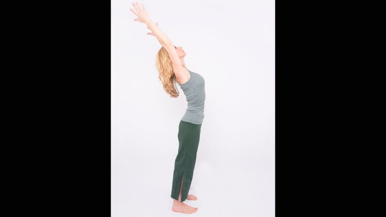 Reaching your arms upward, like in mountain with arms up, stabilize through your core as you lift your chest and extend from your mid back, directing your arms and head gently backwards. Initiate the backbend from the middle of your back to avoid hinging or compressing your low back.