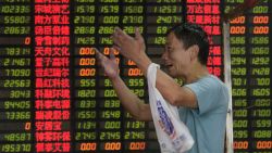 An investor reacts in front of screens showing stock market movements at a brokerage house in Shanghai on September 1, 2015. Shares in Hong Kong and Shanghai slid further on September 1 as data indicating factory activity in China hit a three-year low added to growing concerns about the world's number two economy. AFP PHOTO / JOHANNES EISELEJOHANNES EISELE/AFP/Getty Images