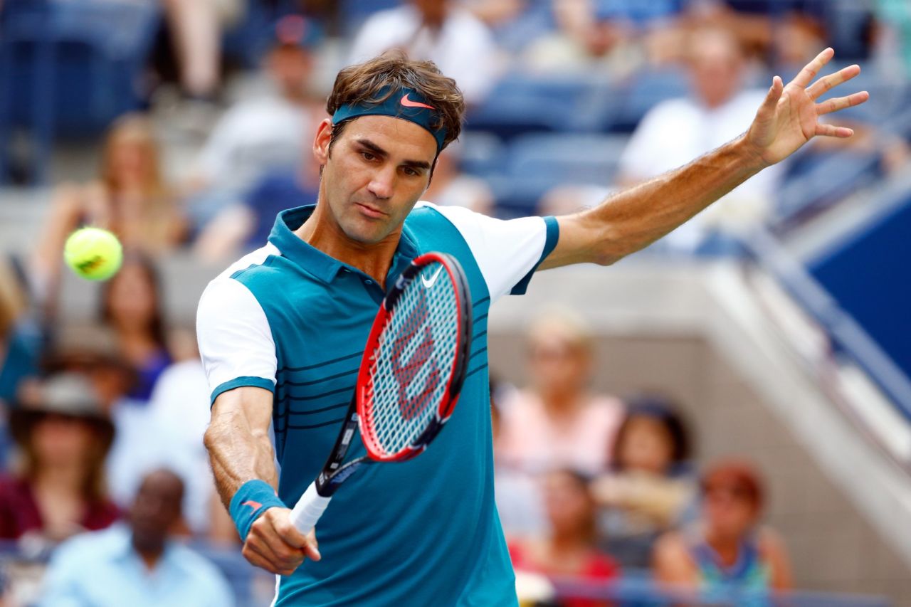 Roger Federer moved into a third place tie for men's victories at the U.S. Open after crushing Leonardo Mayer in the first round Tuesday. 