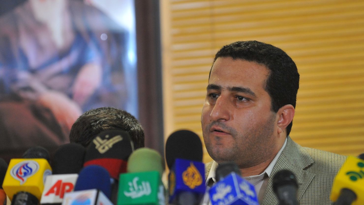 Shahram Amiri speaks to journalists during a press conference after arriving at Imam Khomini Airport July 15, 2010 in Tehran, Iran. 