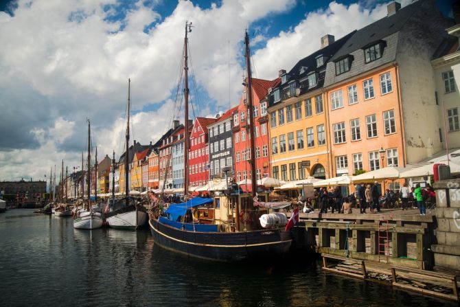 <strong>Nyhavn, Copenhagen:</strong> Denmark is officially the world's happiest country. There's nowhere more Danish to experience life than Nyhavn, the old port in Copenhagen that's now home to restaurants and music along the canal.