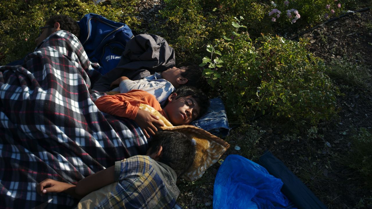 Refugee children sleep near a railway station in Budapest, Hungary.
