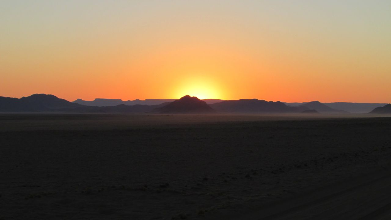 A warm sunset hanging over mountainous terrain in the <a href="http://ireport.cnn.com/docs/DOC-1173055">Kulala Wilderness Reserve</a> in Namibia captivated South African Lauren Haupt. "I loved the huge open spaces and the amazing scenic beauty. The dunes and sunsets. The desert meeting the sea."