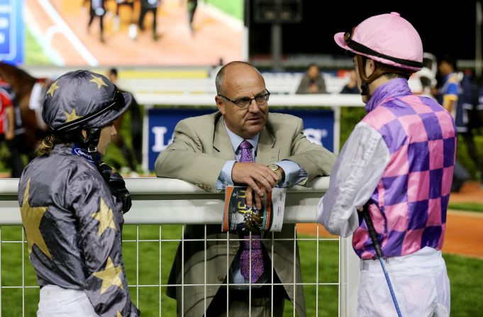 Richard Fahey (center) speaks with jockeys Hayley Turner (left) and James Doyle at Dubai's Meydan Racecourse in 2014. Of Bell he told CNN: "She's very talented is Sammy. She doesn't complicate things. She's got a great racing brain."