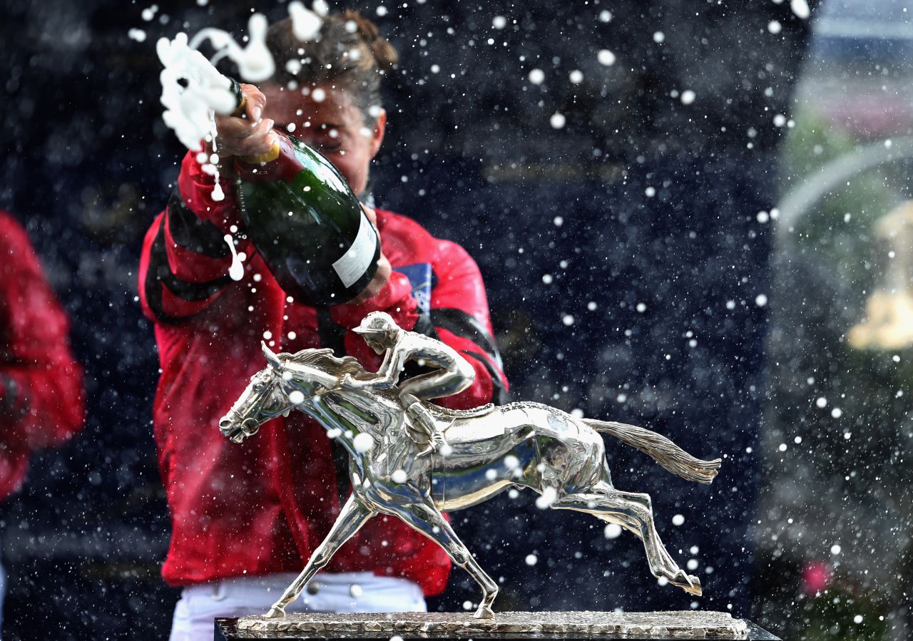 ASCOT, ENGLAND - AUGUST 08:  The Shergar Cup is seen as Hayley Turner sprays champagne during the Dubai Duty Free Shergar Cup at Ascot Racecourse on August 8, 2015 in Ascot, England.  (Photo by Christopher Lee/Getty Images)