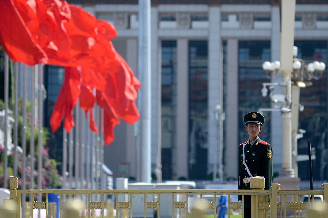 A paramilitary policeman stands at attention in Tiananmen Square in Beijing on September 2, 2015.