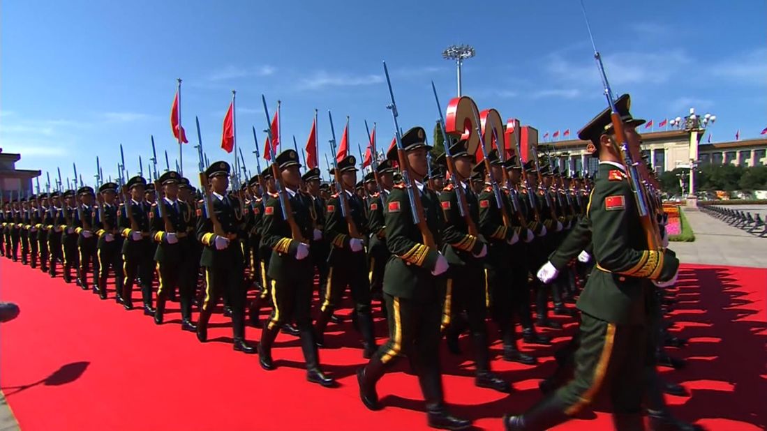 Chinese soldiers march past the Great Hall of the People at Tiananmen Square on September 3, 2015 in Beijing, China.