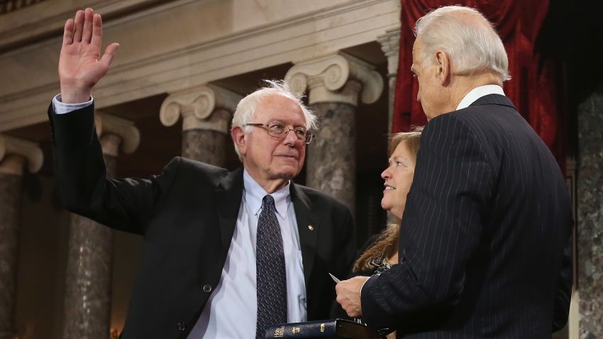 WASHINGTON, DC - JANUARY 03:  U.S. Sen. Bernie Sanders (I-VT) (L) participates in a reenacted swearing-in with his wife  Jane OÕMeara Sanders and U.S. Vice President Joe Biden in the Old Senate Chamber at the U.S. Capitol  January 3, 2013 in Washington, DC. Biden swore in the newly-elected and re-elected senators earlier in the day on the floor of the current Senate chamber.  (Photo by Chip Somodevilla/Getty Images)