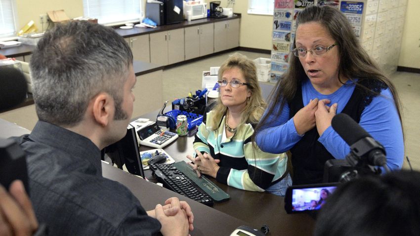Rowan County Clerk Kim Davis, right, talks with David Moore following her office's refusal to issue marriage licenses at the Rowan County Courthouse in Morehead, Ky., Tuesday, Sept. 1, 2015. Although her appeal to the U.S. Supreme Court was denied, Davis still refuses to issue marriage licenses.