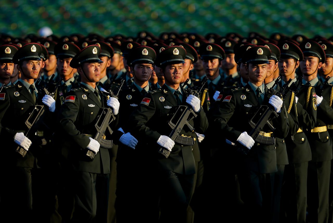 People's Liberation Army troops arrive at Tiananmen Gate in formation for the parade on September 3.