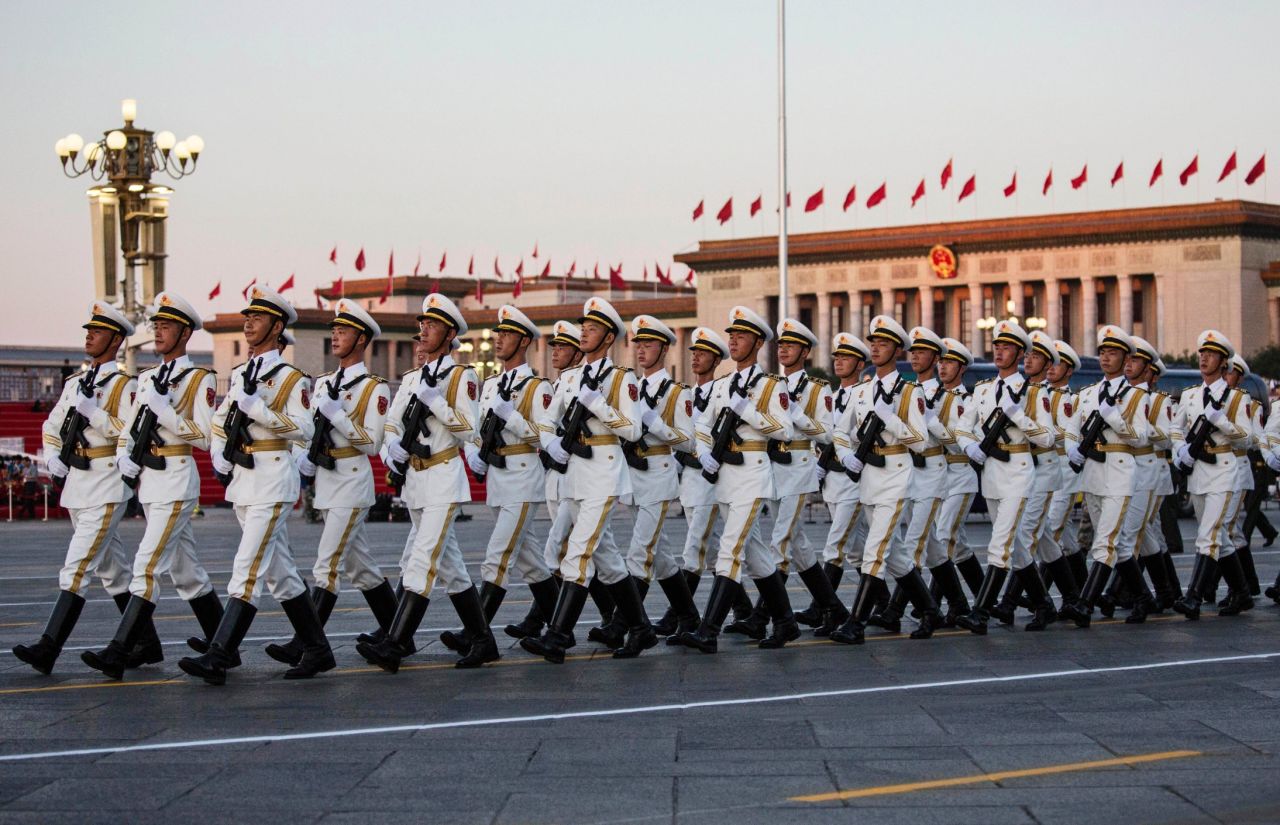 Chinese soldiers march past the Great Hall of the People in Tiananmen Square on September 3 in Beijing, China.
