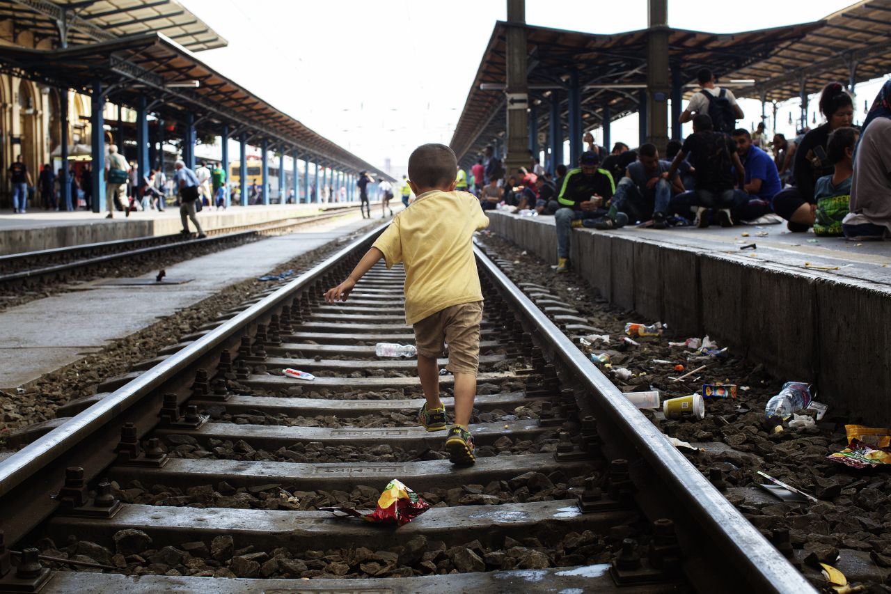 A child walks on the tracks of the Keleti railway station.