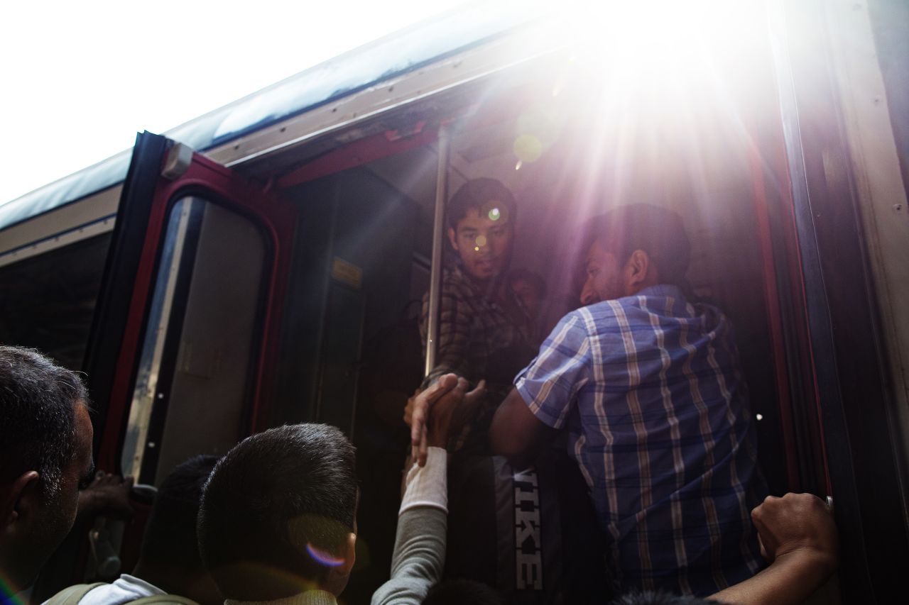 Migrants try to board trains in Budapest.
