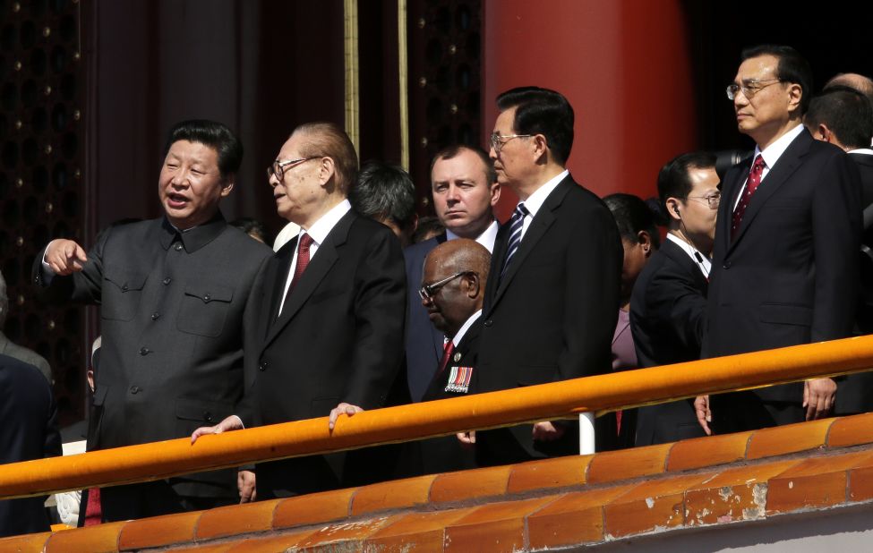 Chinese President Xi Jinping, left, stands with former Chinese Presidents Jiang Zemin and Hu Jintao and current Premier Li Keqiang at the military parade in Beijing on September 3.