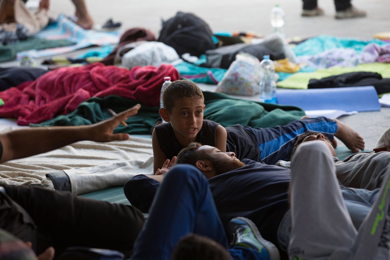 Refugees and migrants gather in the transit zone of Keleti station. 