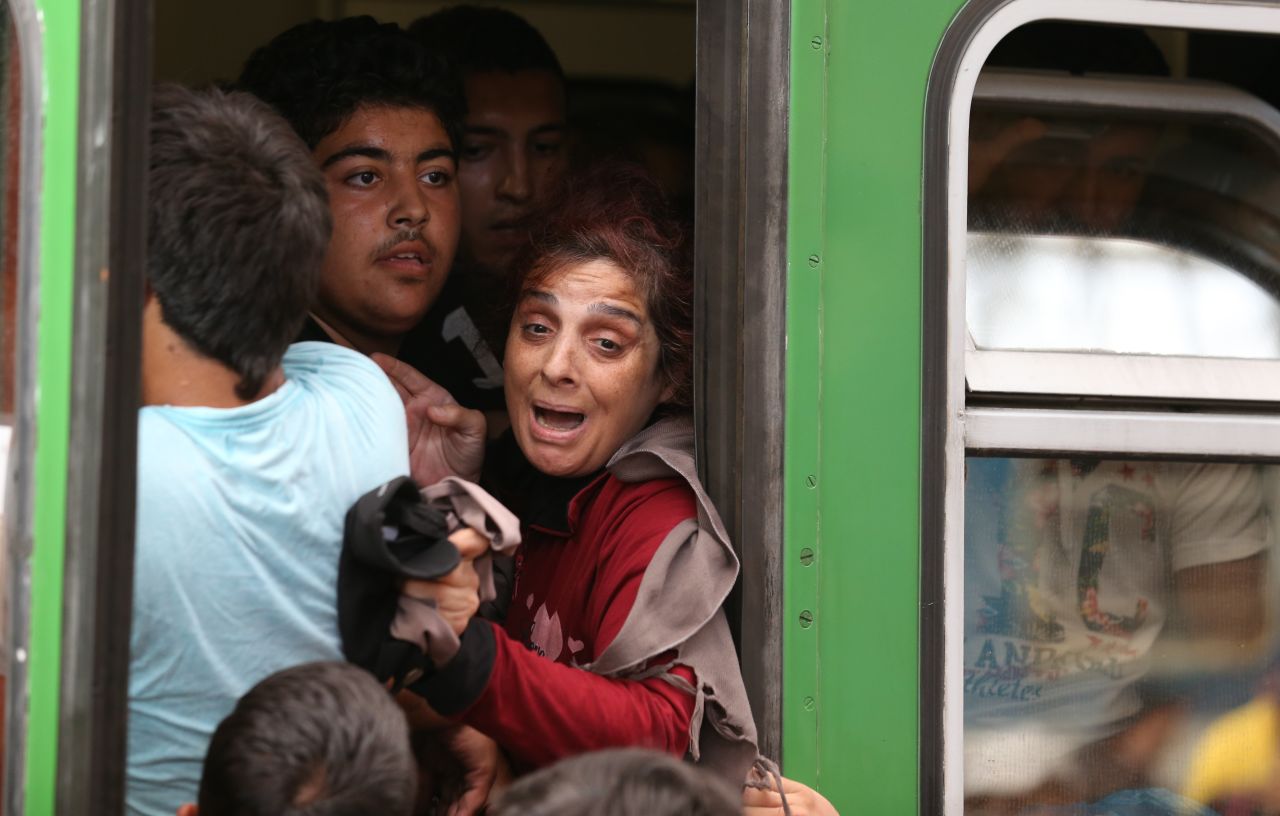 The migrants are free to travel to migrant camps in Hungary but won't be able to board an international train service, a Hungarian government spokesman said.