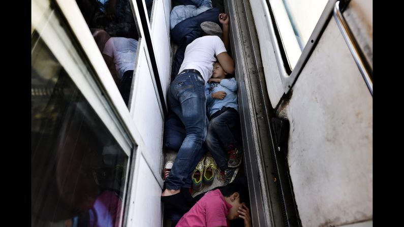 Syrian refugees sleep on the floor of a train car taking them from Macedonia to the Serbian border in August 2015. <a href="index.php?page=&url=http%3A%2F%2Fwww.cnn.com%2F2015%2F08%2F28%2Fworld%2Fiyw-migrant-how-to-help%2Findex.html" target="_blank">How to help the ongoing migrant crisis</a>