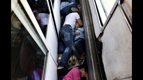 Syrian refugees sleep on the floor of a train car taking them from Macedonia to the Serbian border in August 2015. <a href="http://www.cnn.com/2015/08/28/world/iyw-migrant-how-to-help/index.html" target="_blank">How to help the ongoing migrant crisis</a>