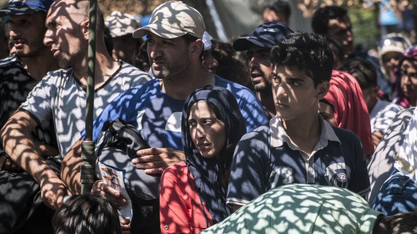 Migrants wait to receive necessary documents at the refugee center in the town of Presevo, on August 26, 2015. The Hungarian government said August 26 it plans to deploy the army to help stem the flow of migrants crossing from Serbia, with parliament set to vote on the move at an extraordinary session next week. AFP PHOTO / ARMEND NIMANI        (Photo credit should read ARMEND NIMANI/AFP/Getty Images)