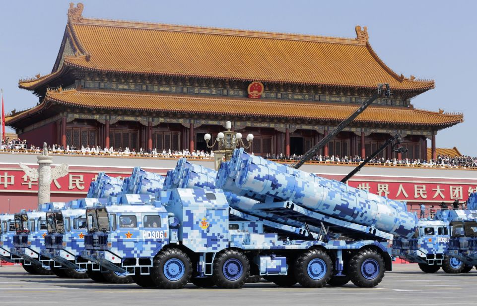 Military vehicles carry missiles past the Tiananmen Gate on September 3.