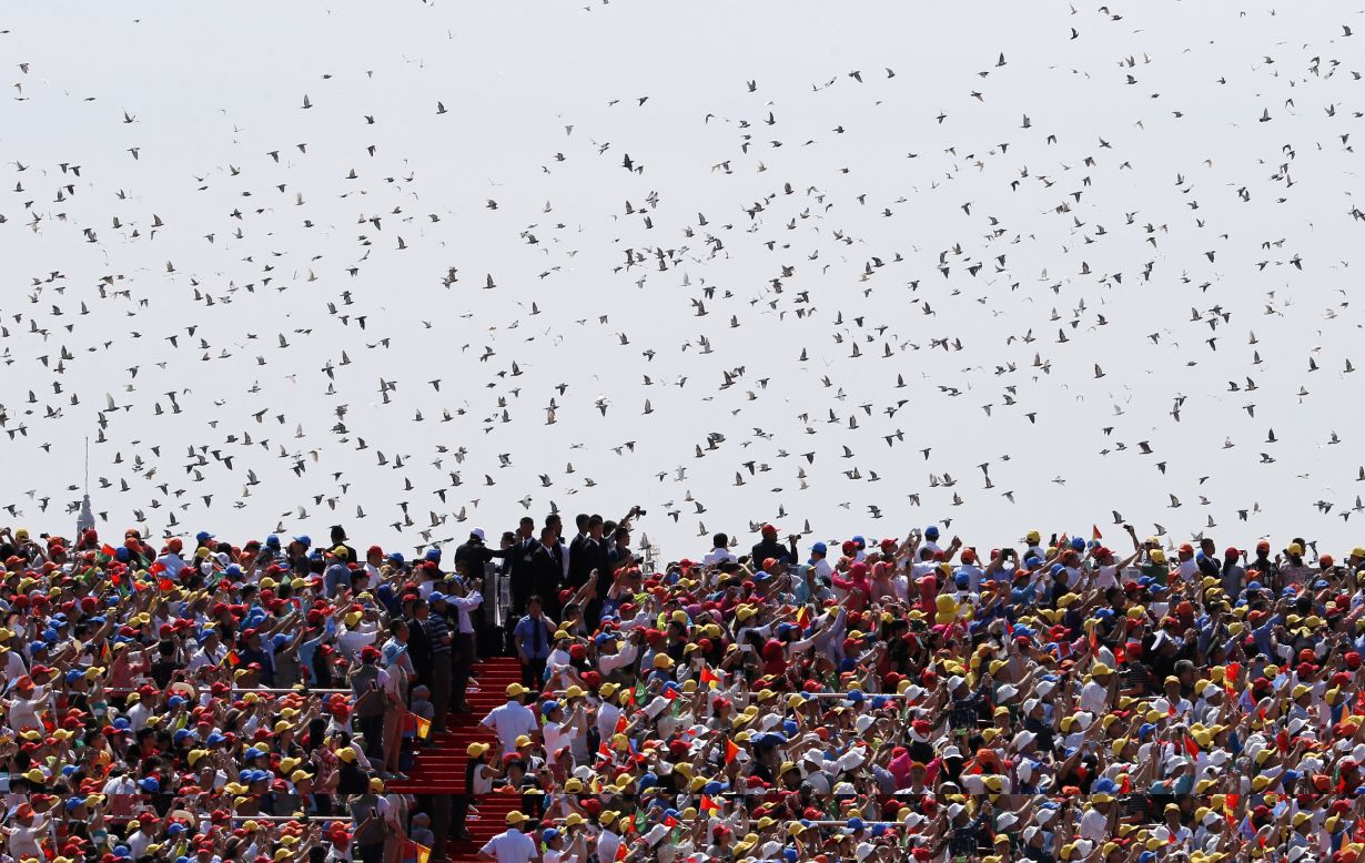 Thousands of doves are released during the parade on September 3.