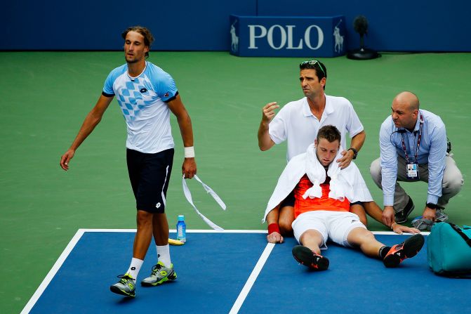 American Jack Sock had to retire against Ruben Bemelmans after he collapsed onto the court amid the intense heat at the U.S. Open on Thursday. 