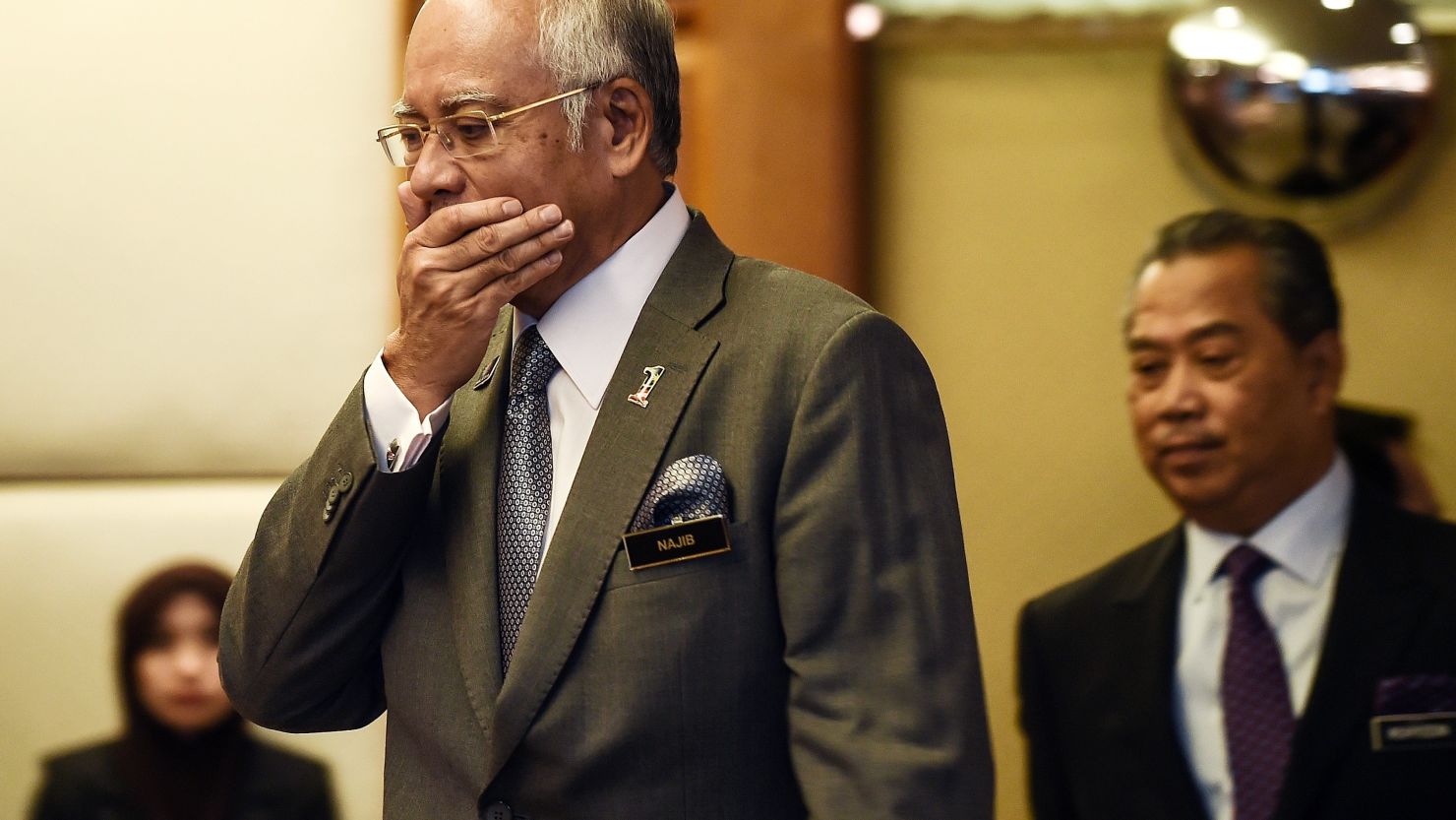Embattled Malaysian Prime Minister Najib Razak (L) gestures as he arrives along with Deputy Prime Minister Muhyiddin Yassin (R) to take part in an event for new government interns at the Prime Minister's office in Putrajaya in this photo taken July 28, 2015.