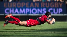 Toulon's fly-half Matt Giteau dives to score a try during the European Rugby Champions Cup match between Toulon and Llanelli Scarlets at the Mayol stadium in Toulon, southeastern France, on October 19, 2014. AFP PHOTO/BERTRAND LANGLOISBERTRAND LANGLOIS/AFP/Getty Images