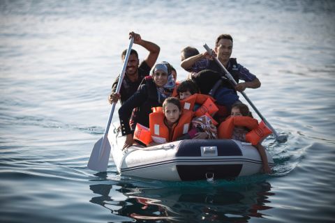 Tens of thousands of refugees are hopping in small boats and sailing from Turkey to Kos to seek asylum in Greece. Here, a Syrian family arrives in an inflatable dinghy at Kos on August 30.